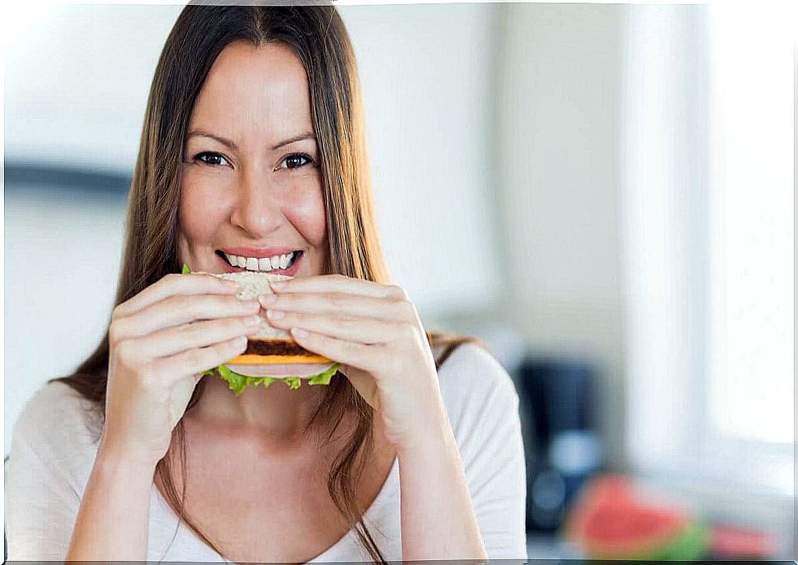 woman eating sandwich