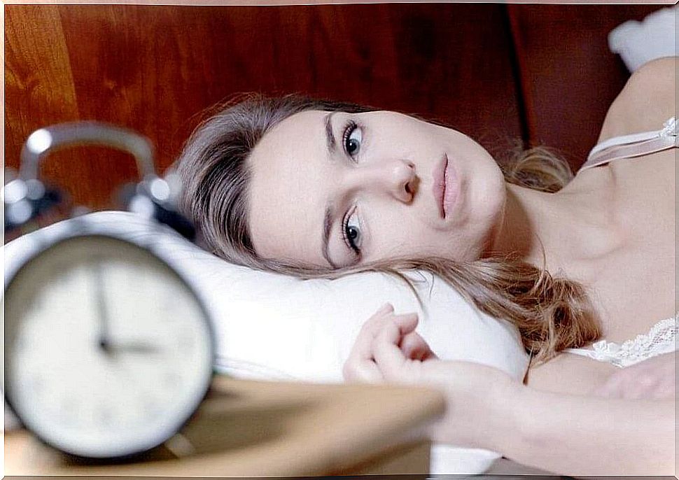 Woman feeling tired and unable to sleep