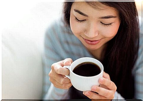 woman drinking hot drink