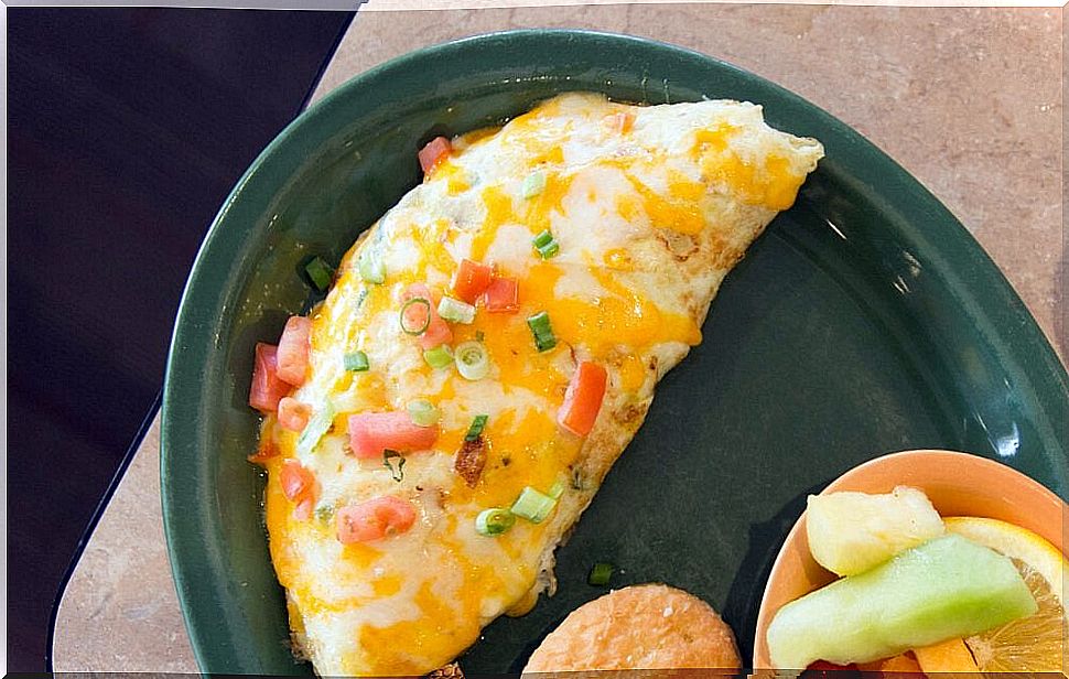 Delicious omelet stuffed with ham and cheese