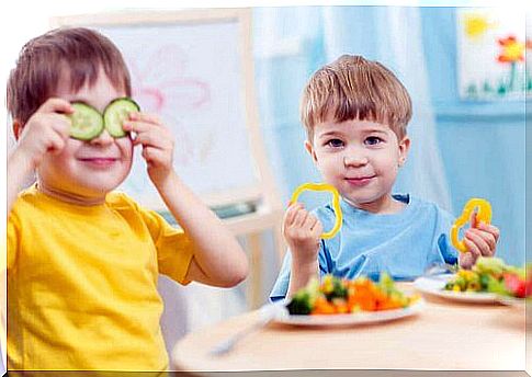 Children playing with vegetables.