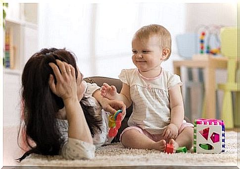 mother playing with baby