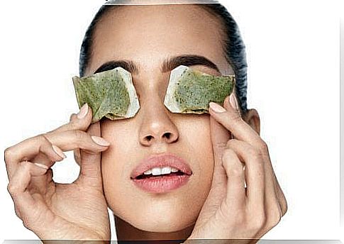 Woman with tea bags in eyes