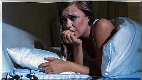 Woman suffering from nocturnal panic attack