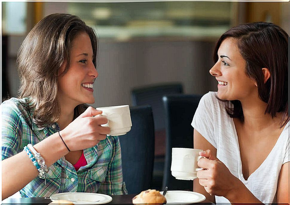 women drinking coffee and talking